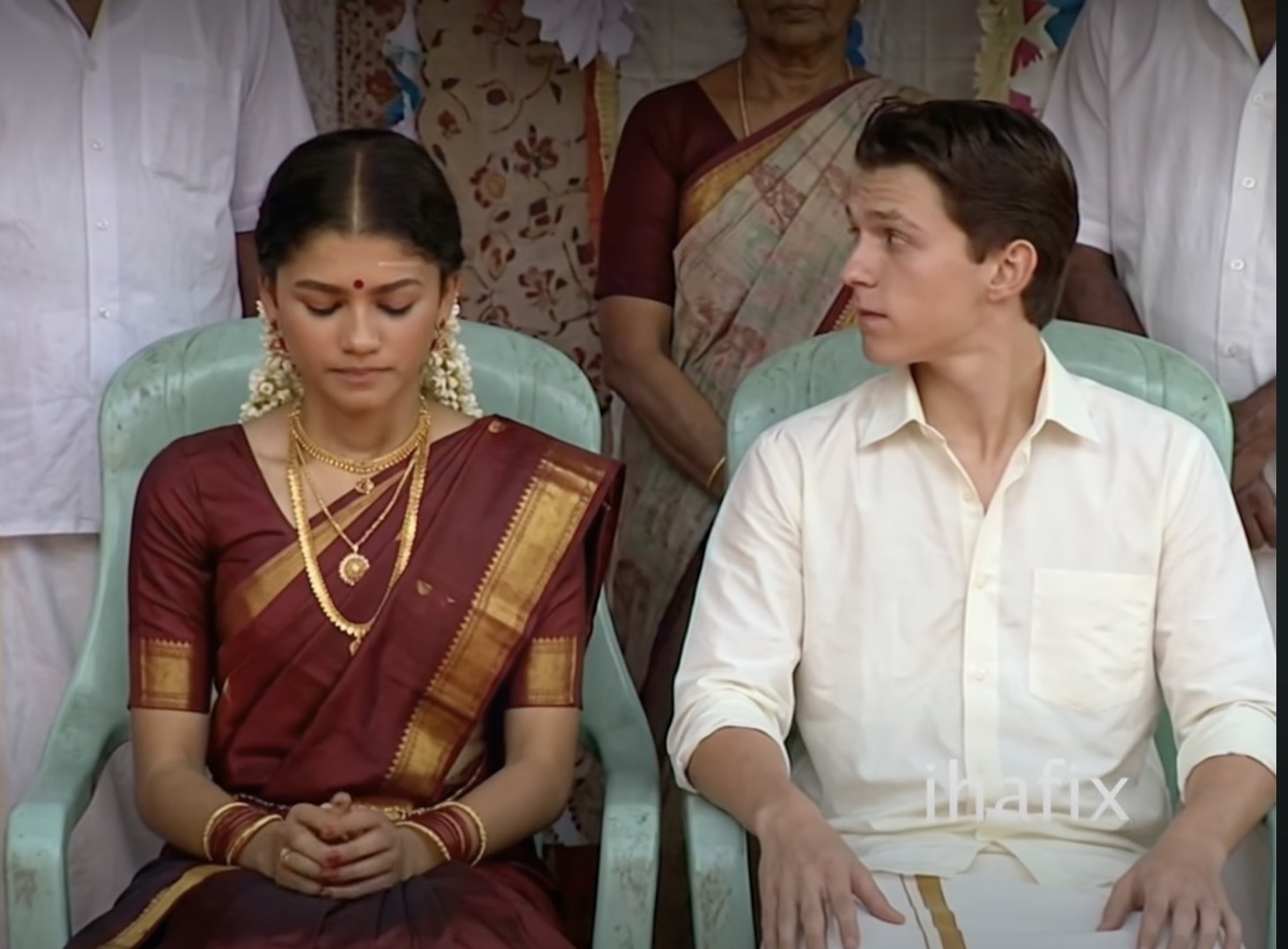 Tom Holland and Zendaya as a South Indian wedding couple, seated in green plastic chairs with guests behind them